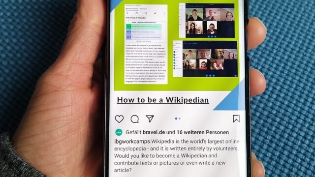 Person holding a smartphone in one hand