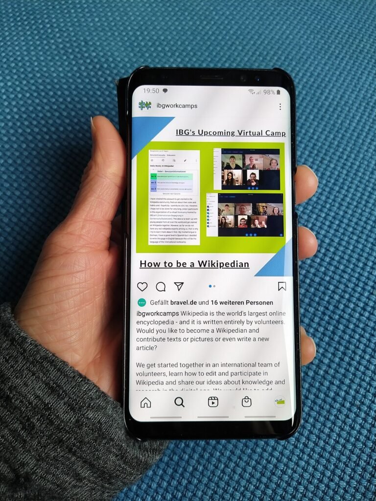 Person holding a smartphone in one hand