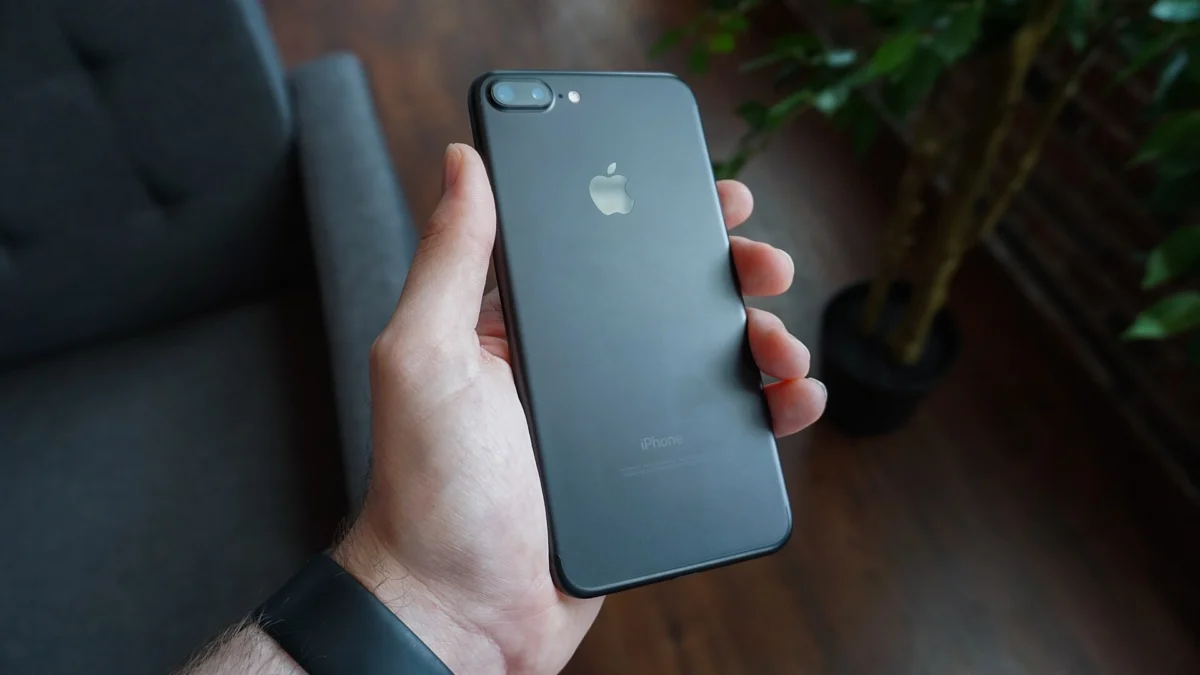 Hand holding a black smartphone