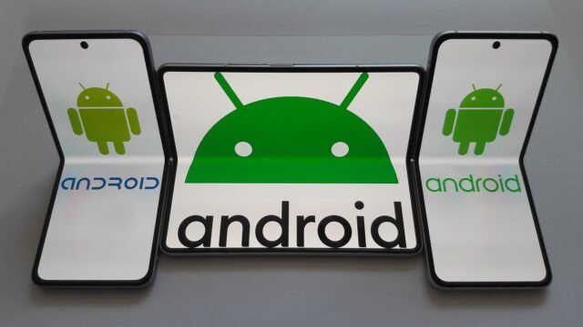 Android logos and characters displayed on a foldable smartphone