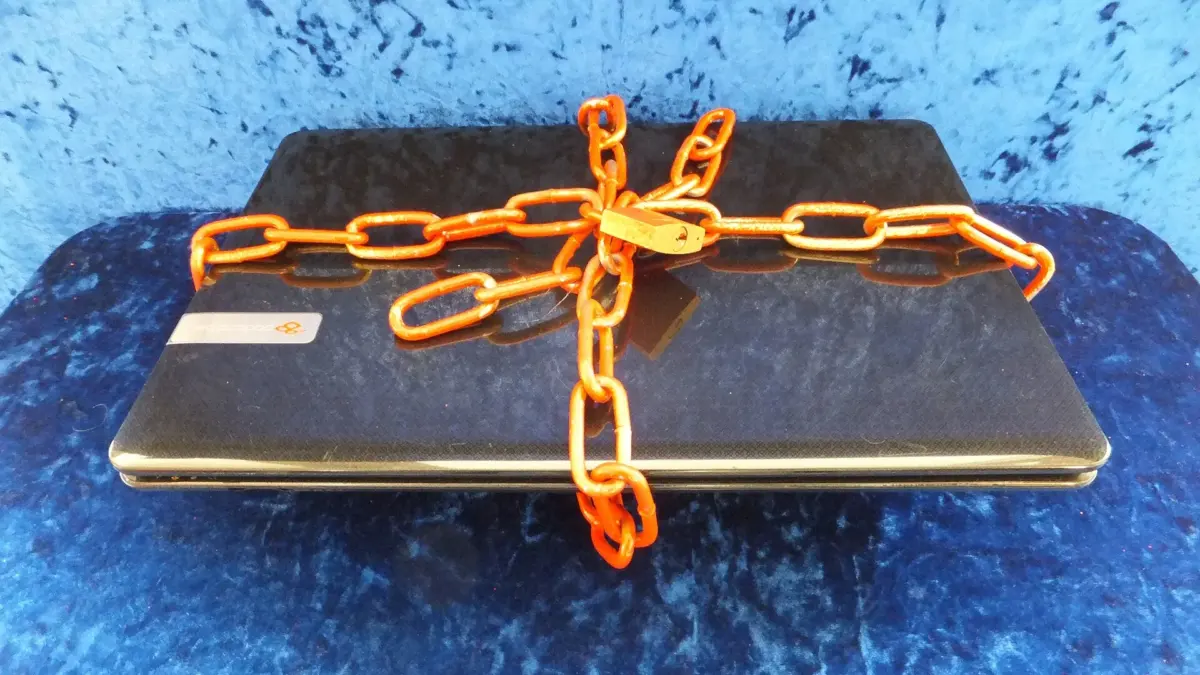 Laptop secured with a padlock and chain